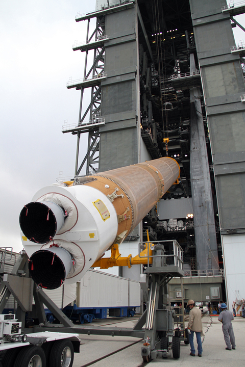A crane lifts a rocket fuel tank
