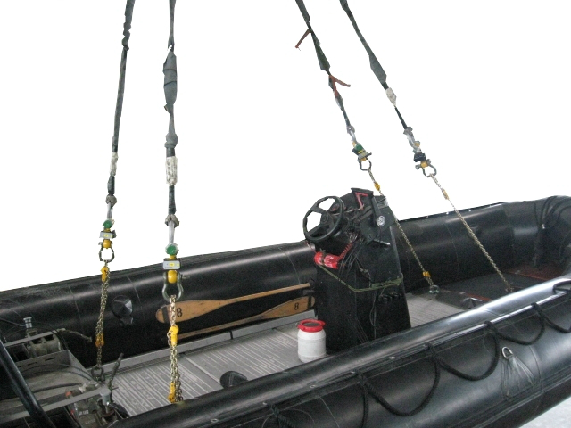 Inflatable speedboat with 4 chains ready for rapid transport under a helicopter